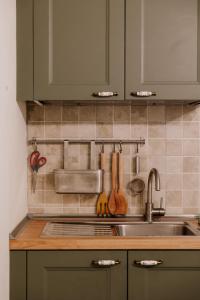 a kitchen with a sink and a counter top at Casa del Bosco in Rubiana