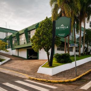 a sign in front of a building at Estrela Palace Hotel in Estrêla