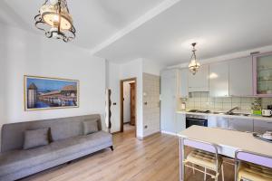 a living room with a couch and a table at Casa Antony in Torri del Benaco +16 photos