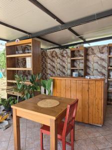 a wooden table and chairs in a room at Villa Marusia in Tollo