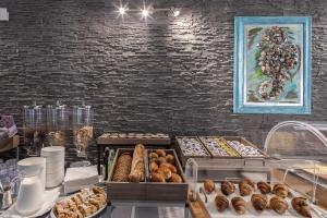 a table with many different types of pastries at Hotel Al Sole in Grado +23 photos