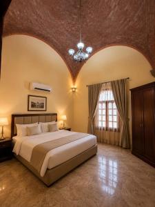a bedroom with a large bed and a large window at Luxor Mountain View in Luxor