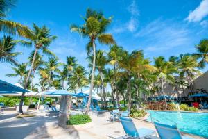 a pool at the resort with palm trees at Marriott Isla Verde Beach Resort in Carolina