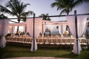 a group of tables with white drapes and chairs at Marriott Isla Verde Beach Resort in Carolina +139 photos
