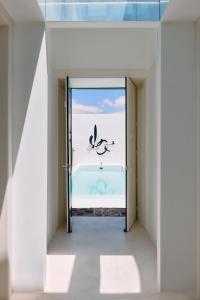 an open door to a room with a view of the ocean at Casa Montelongo - Adults Only in La Oliva