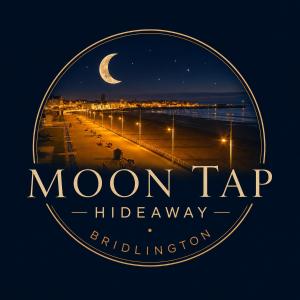 a sign for moon tar high frequencyriction on a beach at Moon Tap Hideaway in Bridlington