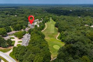a red heart balloon flying over a golf course at Birdies & Bikes at Fairway 45 in Bella Vista