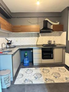 a kitchen with a sink and a stove at Arden home in Van