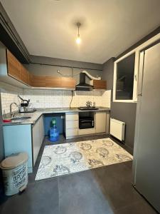 a small kitchen with a sink and a stove at Arden home in Van +2 photos