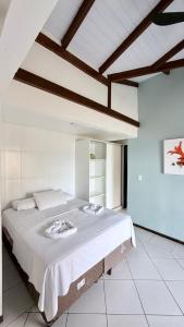 a bedroom with a large bed in a room at Pousada Vila do Navegante in Bombinhas +122 photos