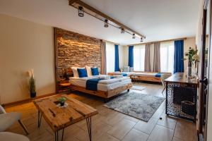 a living room with a couch and a table at Арбория in Koprivshtitsa