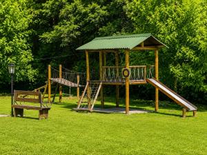 a playground with a slide and a gazebo at Pousada Charme da Montanha in Monte Verde