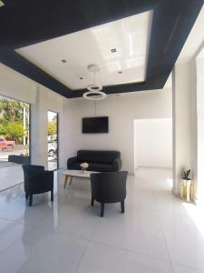 a living room with a couch and a table at Hotel Astoria in Villa Carlos Paz