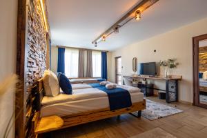 a bedroom with a large bed in a room at Арбория in Koprivshtitsa +26 photos