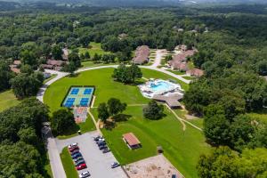 an aerial view of a park with a pool at Birdies & Bikes at Fairway 45 in Bella Vista