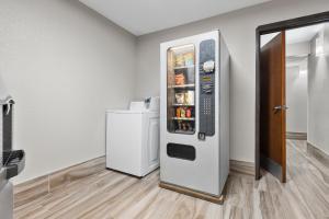 a refrigerator in the corner of a room at Quality Inn Sheridan in Sheridan