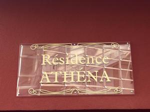 a sign for a restaurant in akron on a wall at Eden-Novia in Orléans +3 photos