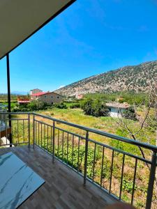 a balcony with a view of a hill at Villa Kalaj in Baks-Rrjoll