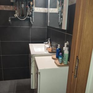 a bathroom with a sink and a mirror at Italian stile in Spa