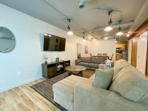 a living room with a couch and a table at Ingalls Flat in De Smet