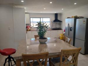 a kitchen with a table with a potted plant on it at Dubbo Farm in Dubbo