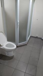 a bathroom with a toilet and a shower at RPCB Condo Rental in Cagayan de Oro +9 photos