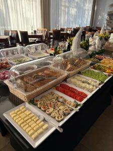 a buffet of different types of food on a table at Kolejarz Natura Tour in Zakopane