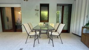 a dining room table and chairs in a room at Crystal House in Montesilvano