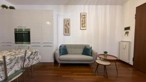 a bedroom with a bed and a chair and a table at Crystal House in Montesilvano