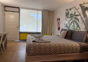 a bedroom with a large bed and a large window at Lyrios Vacation Rentals - Legacy in Kissimmee