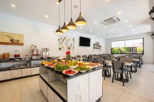 a buffet in a restaurant with many plates of food at Laristone Suite Spa Hotel in Antalya
