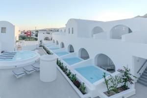 a view of the pool on the roof of a house at Antoperla Luxury Hotel & Spa - featuring the New Antoperla Adults Only Wing in Perissa