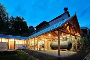 a large greenhouse with a roof on top of it at Pivovar Lobeč in Lobeč