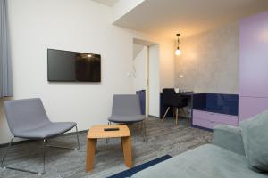 TV a/nebo společenská místnost v ubytování Fairhotel