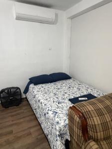 a bedroom with a bed in a room at Casa Tulipán in Monterrey