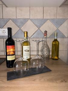 a group of wine bottles sitting on a counter at Del Rio Palace Guest House in Certaldo