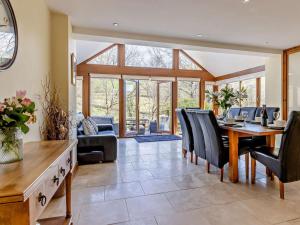 a dining room with a table and chairs at 4 Bed in Llanidloes oc-95968 in Van