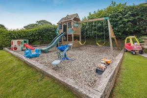 a playground with play equipment in a yard at 3 Bed in Brecon oc-bn363 in Brecon