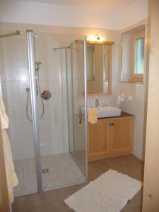 a bathroom with a shower and a sink at Ferienwohnungen Obermoarhof in Lagundo