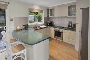 a kitchen with a large counter top in a room at Bliss by the Bay in Metung