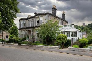 an old house on the side of a street at Victoria Square & The Orangery in Stirling