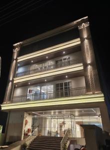 a large building with stairs in front of it at The Vatika Paradise in Ayodhya