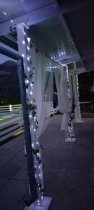 a wedding aisle with white curtains and lights at Los Cabales in Torres