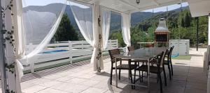 a porch with a table and chairs and a view at Los Cabales in Torres +70 photos