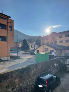 a black car parked next to a stone wall at B&b DA FELICE MONOLOCALE in Serino