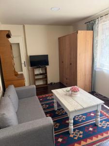 a living room with a couch and a coffee table at Chata Dorka in Kamenica nad Hronom