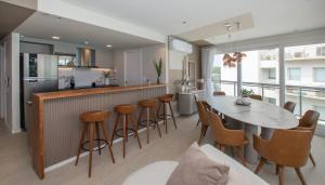 a kitchen and dining room with a table and chairs at 3BR Apartment Pool & Garage Sleeps 6 in San Bernardino +39 photos