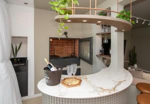 a kitchen with a round counter with plants on it at 3BR Apartment Pool & Garage Sleeps 6 in San Bernardino