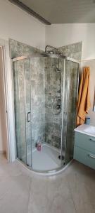 a shower with a glass door in a bathroom at House biase e marrys in Trecchina +22 photos