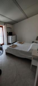 a bedroom with a large bed in a room at House biase e marrys in Trecchina